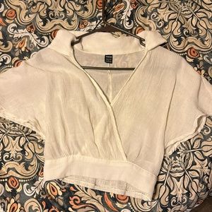 V-Neck crop top. Never worn, but no tags